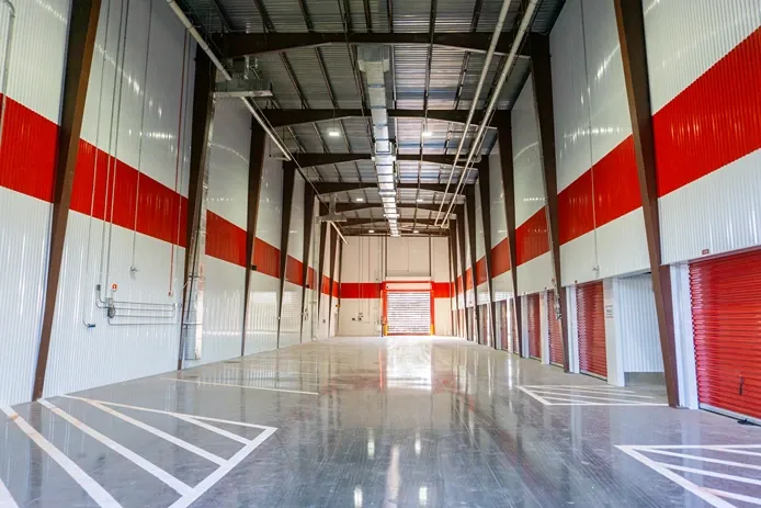 Spacious indoor vehicle access for climate-controlled storage units